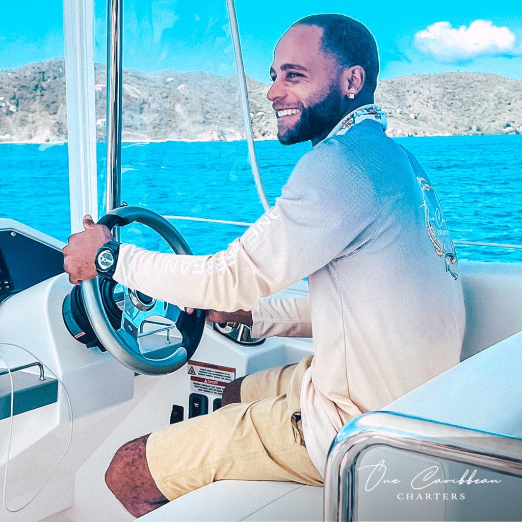 captain Rikky of One Caribbean boat chart driving yacht